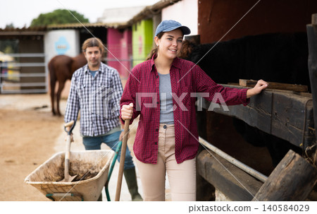 female farm worker standing with a smile and instruments female farm worker standing with a smile and instruments 140584029
