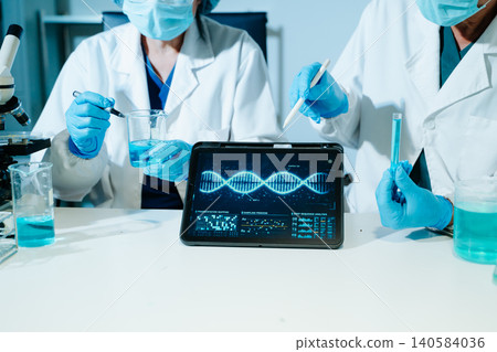 Scientists performing DNA genome analysis using digital tablet interface in biotechnology laboratory for medical research, genetics, pharmaceutical innovation and AI diagnostics. Scientists performing DNA genome analysis using digital tablet interface in biotechnology laboratory for medical research, genetics, pharmaceutical innovation and AI diagnostics. 140584036