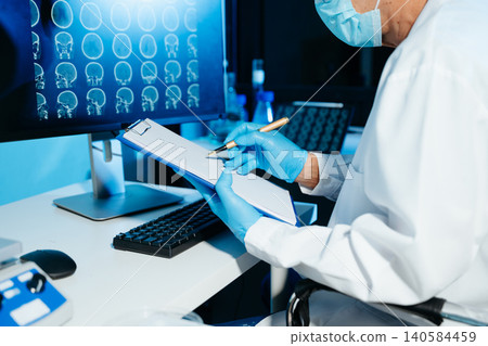 Medical scientist working in laboratory, analyzing brain scan images on computer for diagnostics and research, reflecting healthcare technology, data Medical scientist working in laboratory, analyzing brain scan images on computer for diagnostics and research, reflecting healthcare technology, data 140584459