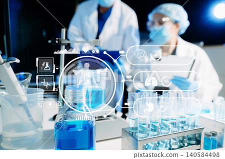 Medical scientists using digital technology and AI tools for laboratory research and diagnostics. Healthcare innovation, biotechnology, data-driven medicine 140584498