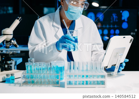 Scientist documenting research data in a modern laboratory, showcasing biotech innovation, medical research, diagnostics Scientist documenting research data in a modern laboratory, showcasing biotech innovation, medical research, diagnostics 140584512