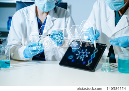 Scientist conducting medical research in modern laboratory using digital healthcare interface, biotechnology analysis, pharmaceutical testing 140584554