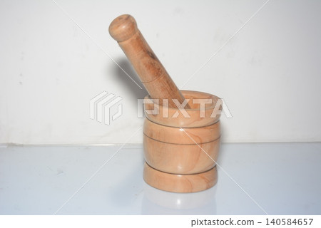Traditional wooden mortar and pestle kitchen tool for crushing herbs Traditional wooden mortar and pestle kitchen tool for crushing herbs 140584657