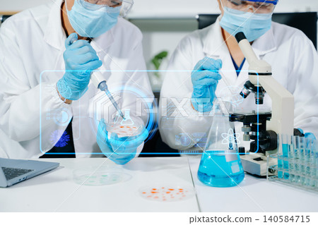 Scientists performing DNA genome analysis using digital tablet interface in biotechnology laboratory for medical research, genetics, pharmaceutical innovation and AI diagnostics. Scientists performing DNA genome analysis using digital tablet interface in biotechnology laboratory for medical research, genetics, pharmaceutical innovation and AI diagnostics. 140584715