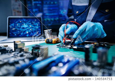 Closeup of expert soldering a green PCB board using precision tools. Ideal for electronics, circuit repair, engineering, tech Closeup of expert soldering a green PCB board using precision tools. Ideal for electronics, circuit repair, engineering, tech 140584753