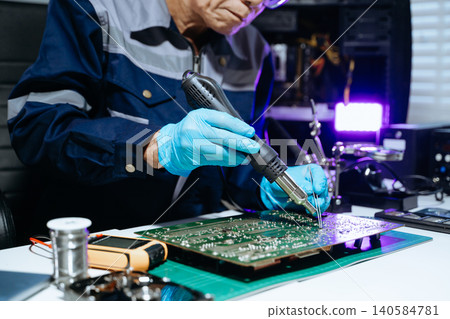 Senior technician performing PCB soldering and diagnostics with multimeter in electronics lab, showcasing hardware engineering Senior technician performing PCB soldering and diagnostics with multimeter in electronics lab, showcasing hardware engineering 140584781