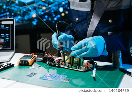 Professional technician soldering power PCB circuit board in electronics lab, showcasing hardware engineering, industrial manufacturing, repair, automation Professional technician soldering power PCB circuit board in electronics lab, showcasing hardware engineering, industrial manufacturing, repair, automation 140584789
