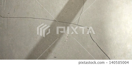 Cracked concrete wall surface with structural fracture patterns and weathered texture. Cracked concrete wall surface with structural fracture patterns and weathered texture. 140585004