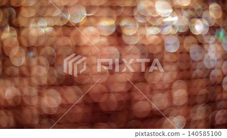 Countless shimmering golden particles of light and a lens-blurred background. Countless shimmering golden particles of light and a lens-blurred background. 140585100