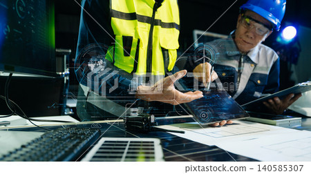 Engineers Monitoring Smart Renewable Energy System with Solar Technology Engineers Monitoring Smart Renewable Energy System with Solar Technology 140585307