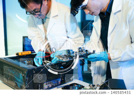 Engineers analyzing computer hardware and motherboard in a modern technology laboratory. Electronics testing, diagnostics and IT engineering Engineers analyzing computer hardware and motherboard in a modern technology laboratory. Electronics testing, diagnostics and IT engineering 140585431