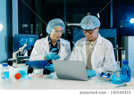 Medical scientists working in laboratory conducting research, testing samples, and analyzing results, showcasing healthcare teamwork, clinical study, and innovation. Medical scientists working in laboratory conducting research, testing samples, and analyzing results, showcasing healthcare teamwork, clinical study, and innovation. 140585433