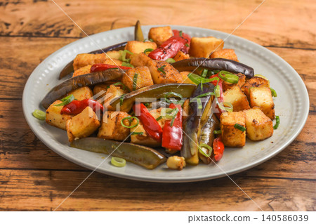 Stir-fried eggplant and fried tofu with oyster sauce Stir-fried eggplant and fried tofu with oyster sauce 140586039