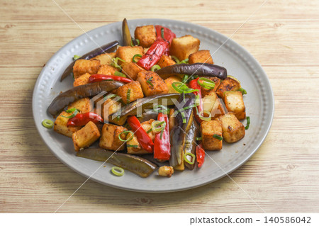 Stir-fried eggplant and fried tofu with oyster sauce Stir-fried eggplant and fried tofu with oyster sauce 140586042