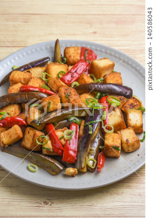 Stir-fried eggplant and fried tofu with oyster sauce Stir-fried eggplant and fried tofu with oyster sauce 140586043