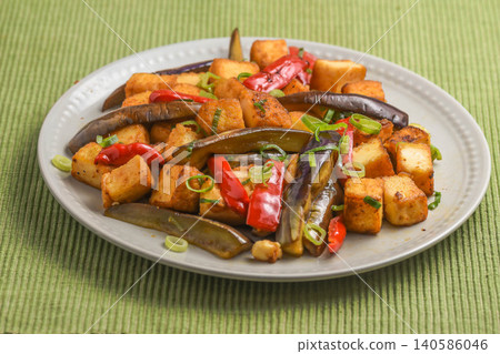 Stir-fried eggplant and fried tofu with oyster sauce Stir-fried eggplant and fried tofu with oyster sauce 140586046