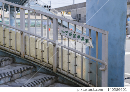 Stairs of the pedestrian overpass in front of Oji Station, Kita Ward 140586601