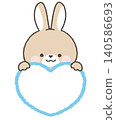 A brown rabbit peeking out from above the heart 140586693