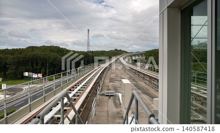 A view of the driverless tracks and trams of the new transit system from the station platform. A view of the driverless tracks and trams of the new transit system from the station platform. 140587418