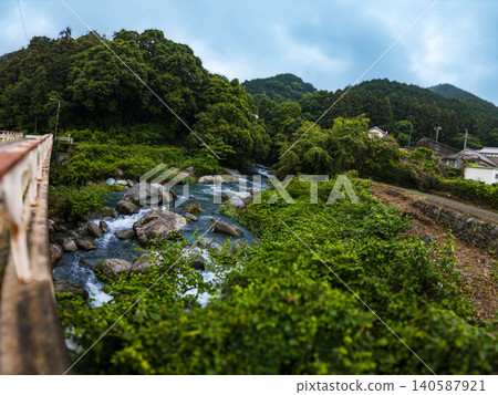 A peaceful rural landscape and beautiful stream scenery in early summer, Niihama City, Ehime Prefecture A peaceful rural landscape and beautiful stream scenery in early summer, Niihama City, Ehime Prefecture 140587921