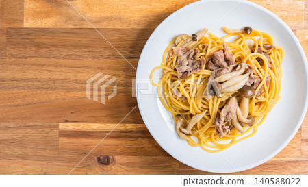 Japanese-style pasta with pork slices and mushrooms Japanese-style pasta with pork slices and mushrooms 140588022
