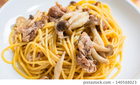 Japanese-style pasta with pork slices and mushrooms Japanese-style pasta with pork slices and mushrooms 140588023