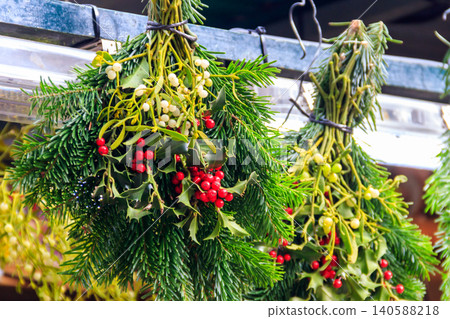 Mistletoe bouquets in sale on Christmas market Mistletoe bouquets in sale on Christmas market 140588218
