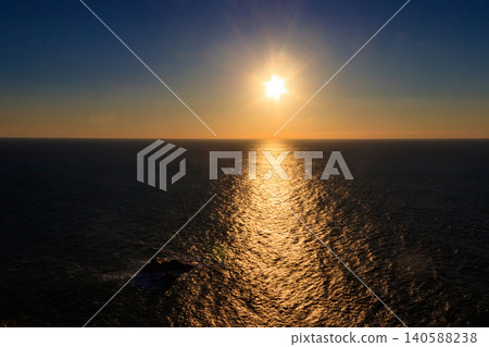 View of the Atlantic Ocean from Cabo da Roca at sunset. Cabo da Roca or Cape Roca is westernmost cape of mainland Portugal, continental Europe and the Eurasian land mass 140588238