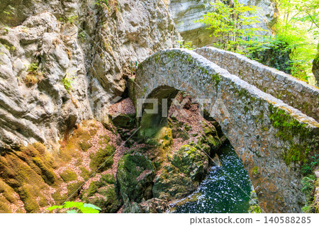 Old small stone bridge over river at Gorges de l'Areuse, Switzerland Old small stone bridge over river at Gorges de l'Areuse, Switzerland 140588285