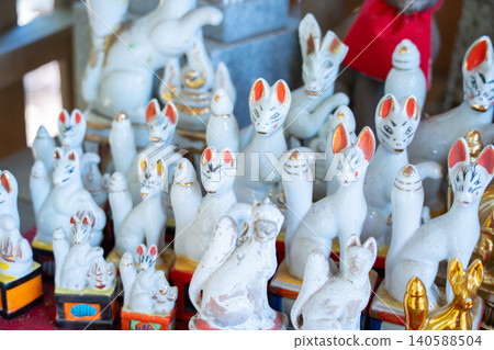 Many cute white fox figurines donated to the shrine Many cute white fox figurines donated to the shrine 140588504