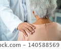 Doctor touch  Asian elderly woman patient with love, care, encourage and empathy at  hospital. 140588569