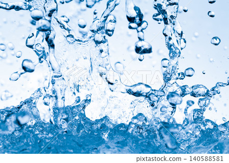 Water splashes against an abstract blue background for beauty purposes. Water splashes against an abstract blue background for beauty purposes. 140588581