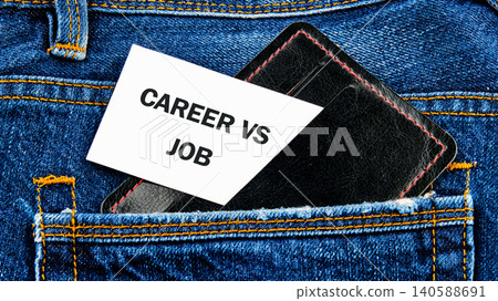 A note reading career vs job sits in a black wallet placed in the back pocket of denim jeans. The focus is on the contrast between career and job in daily life A note reading career vs job sits in a black wallet placed in the back pocket of denim jeans. The focus is on the contrast between career and job in daily life 140588691