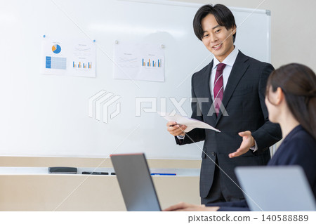 A man giving a presentation 140588889