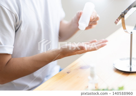 A man's hands while doing skincare A man's hands while doing skincare 140588960