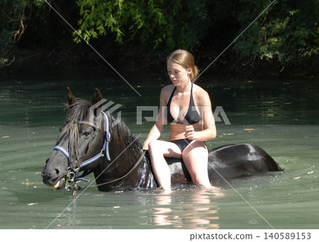riding girl and horse in river riding girl and horse in river 140589153
