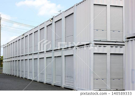 A facility of storage units and rental warehouses with shutters neatly lined up. A facility of storage units and rental warehouses with shutters neatly lined up. 140589333