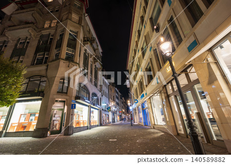 A night view of the old town, with its illuminated historical buildings and traditional architecture. Lucerne, Canton of Lucerne, Switzerland. A night view of the old town, with its illuminated historical buildings and traditional architecture. Lucerne, Canton of Lucerne, Switzerland. 140589882