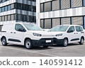 White delivery vans are parked in rows. Commercial fleet of vehicles 140591412