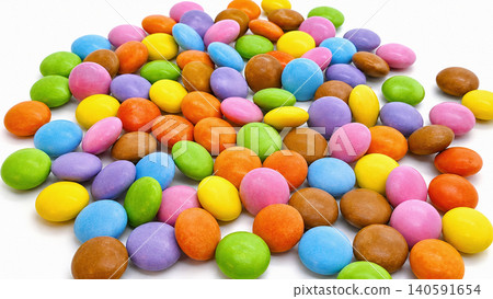 Colorful Candy Coated Chocolate Dragees Scattered on White Background Colorful Candy Coated Chocolate Dragees Scattered on White Background 140591654