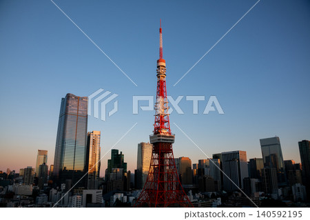 Tokyo: Tokyo Tower illuminated by the morning sun, the cityscape with Tokyo Tower, and the Tokyo cityscape at sunrise. Tokyo: Tokyo Tower illuminated by the morning sun, the cityscape with Tokyo Tower, and the Tokyo cityscape at sunrise. 140592195
