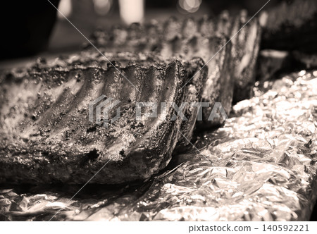 Fried ribs lie on foil Fried ribs lie on foil 140592221