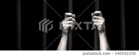 Sad young girl in prison 140592250