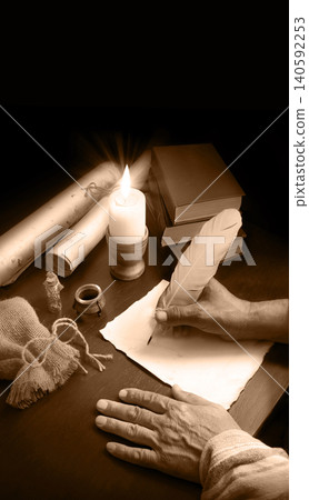 Man writing a letter on a desk Man writing a letter on a desk 140592253