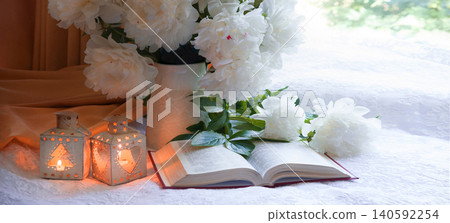 Flowers and book on the table Flowers and book on the table 140592254