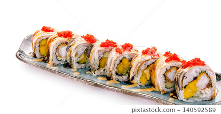 Uramaki sushi rolls with shrimp tempura and mango Uramaki sushi rolls with shrimp tempura and mango 140592589