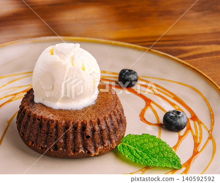 Chocolate lava cake with vanilla ice cream, blueberries, caramel Chocolate lava cake with vanilla ice cream, blueberries, caramel 140592592