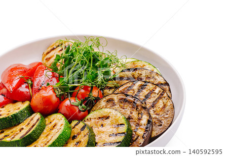 Grilled vegetables bowl with zucchini eggplant bell pepper and tomatoes Grilled vegetables bowl with zucchini eggplant bell pepper and tomatoes 140592595