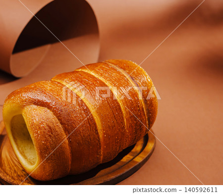 Trdelnik chimney cake on wooden plate Trdelnik chimney cake on wooden plate 140592611