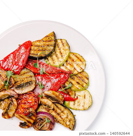 Grilled seasoned vegetables served on white plate for healthy meal Grilled seasoned vegetables served on white plate for healthy meal 140592644